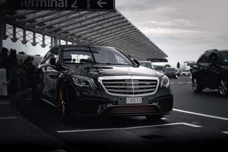 Black executive car parked and ready for a chauffeur booking