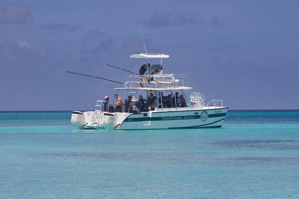 a boat with people on it in the water