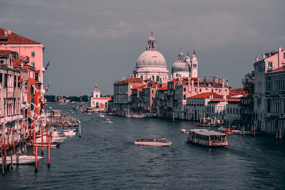 a body of water with boats in it and buildings around it