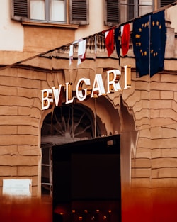 a building with flags from the roof