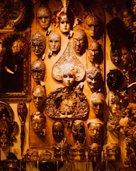 a wall full of antique clocks