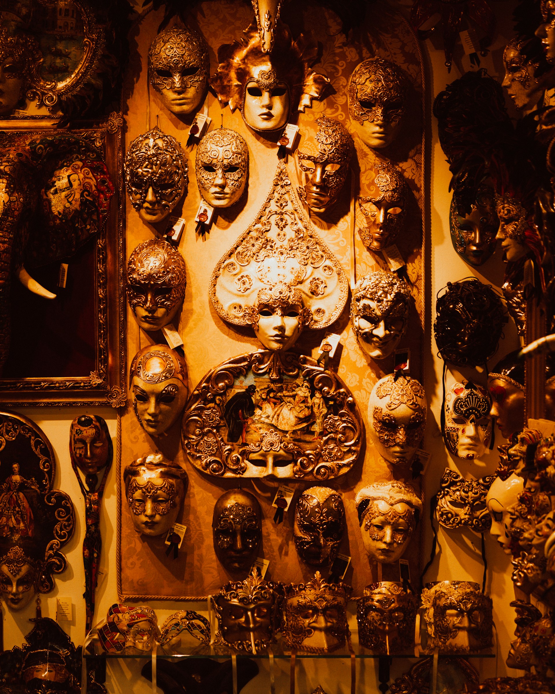 a wall full of antique clocks