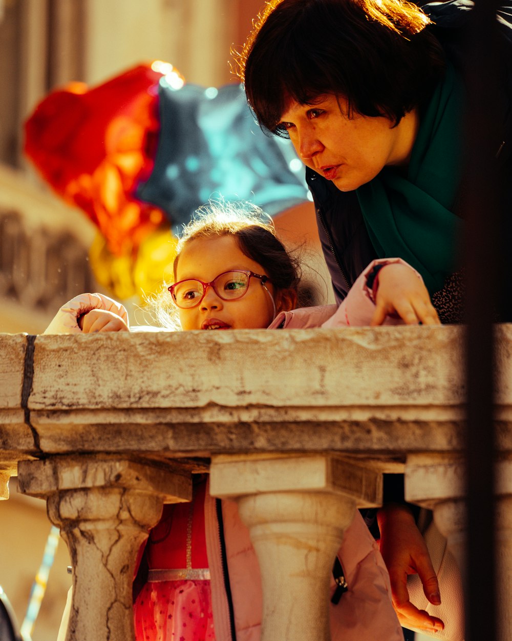 a couple of kids looking at a wooden structure