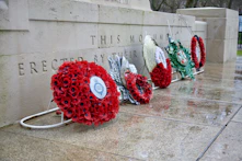 a wreath on a stone wall