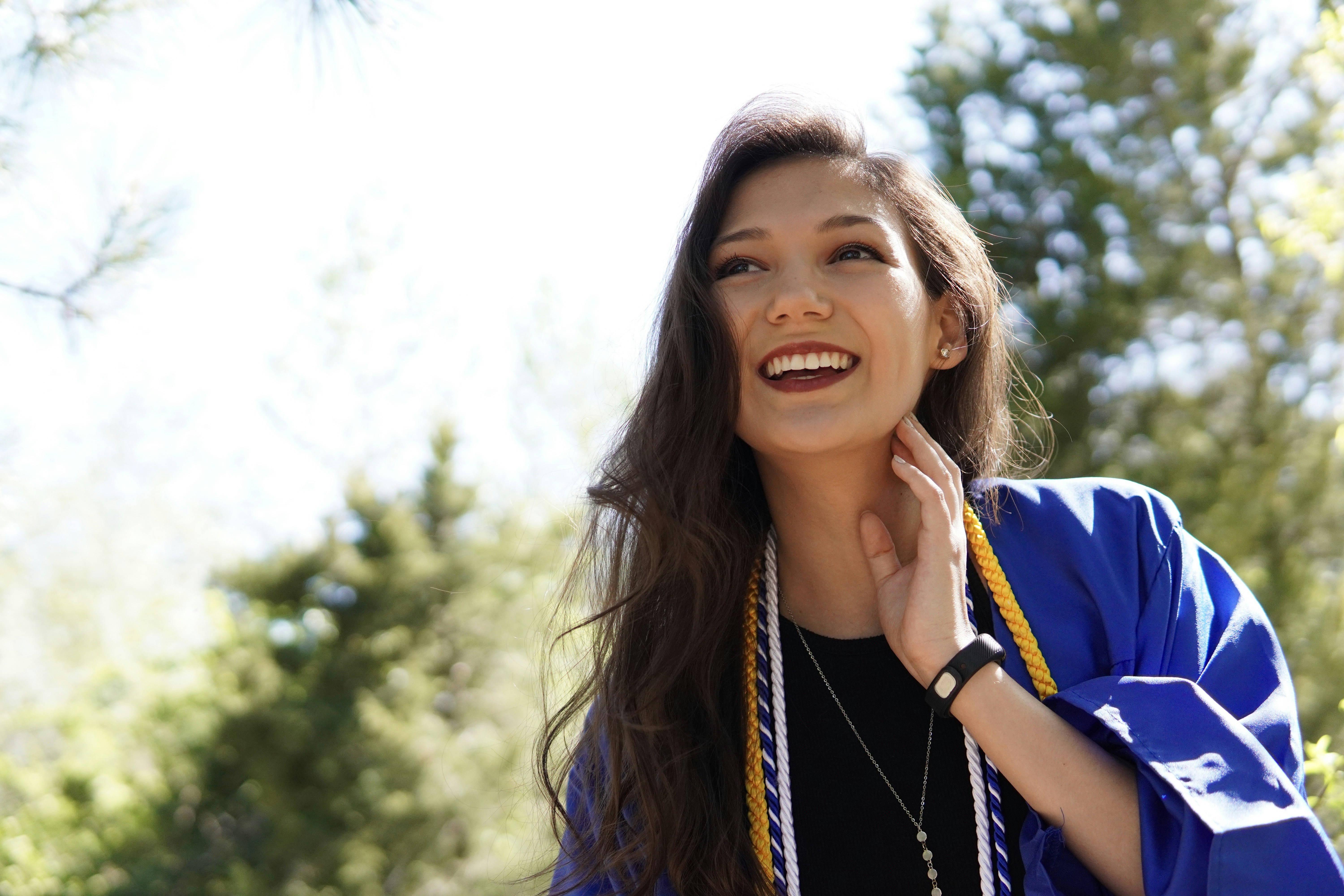 a woman with her hand on her face