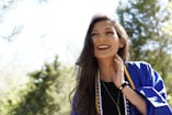 a woman with her hand on her face
