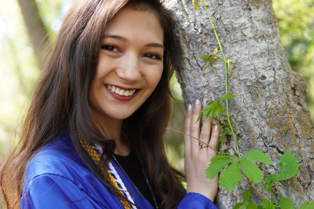 a woman holding a tree