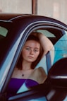 a woman sitting in a car