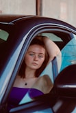 a woman sitting in a car