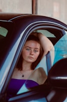 a woman sitting in a car