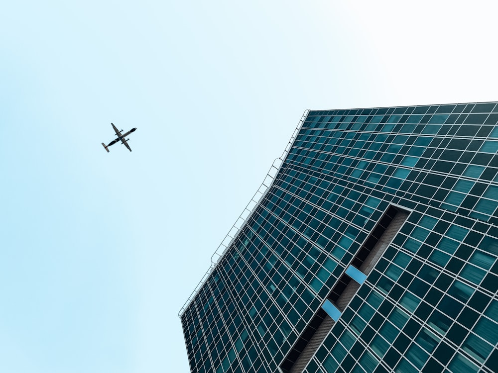 a helicopter flying over a skyscraper