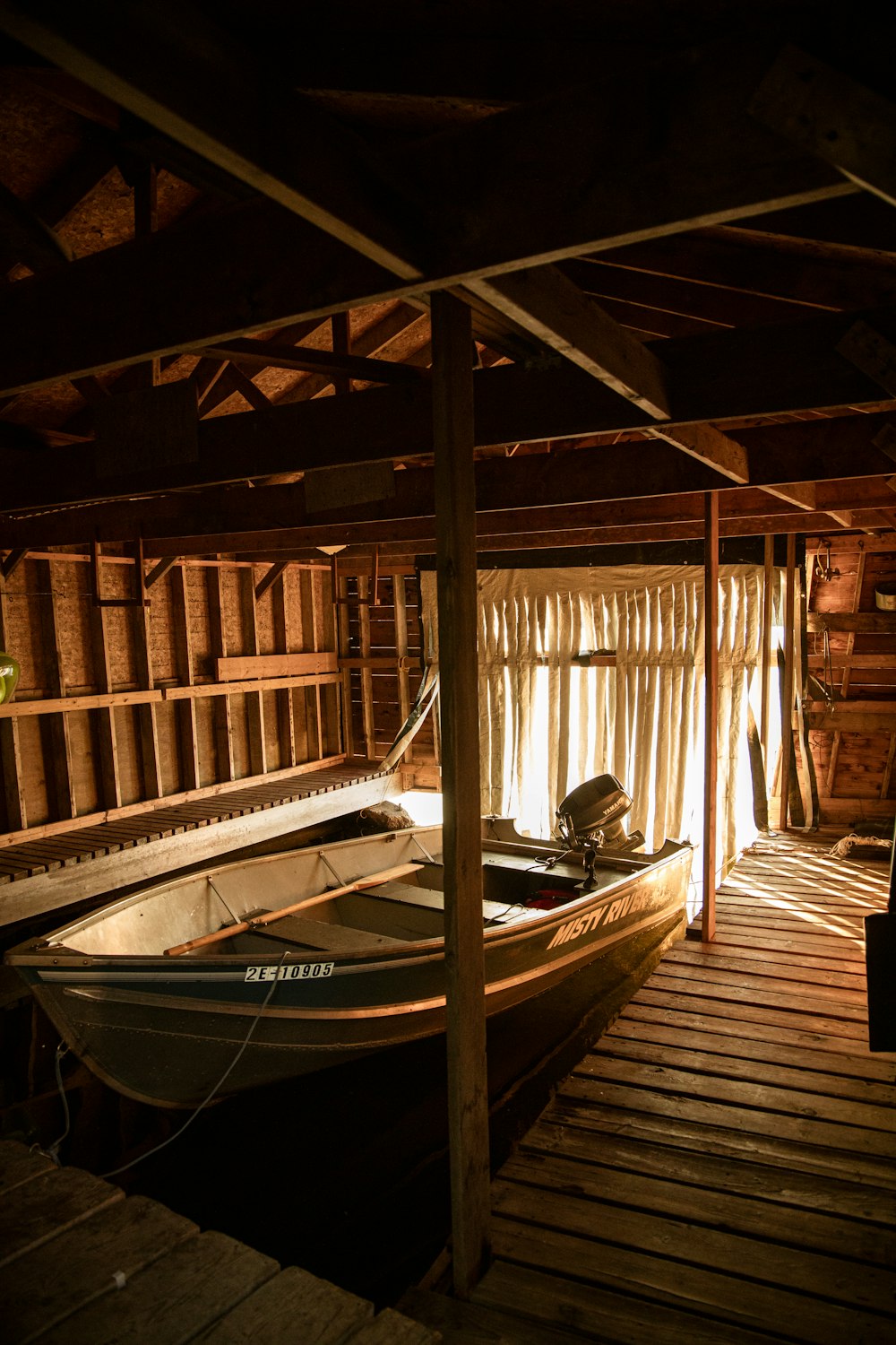 a boat sits in a wooden cabin