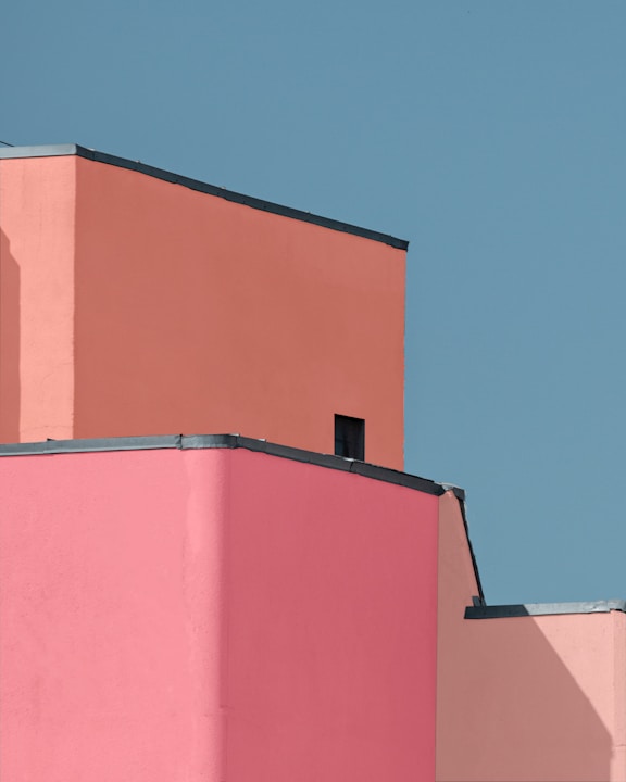 a red building with a blue sky