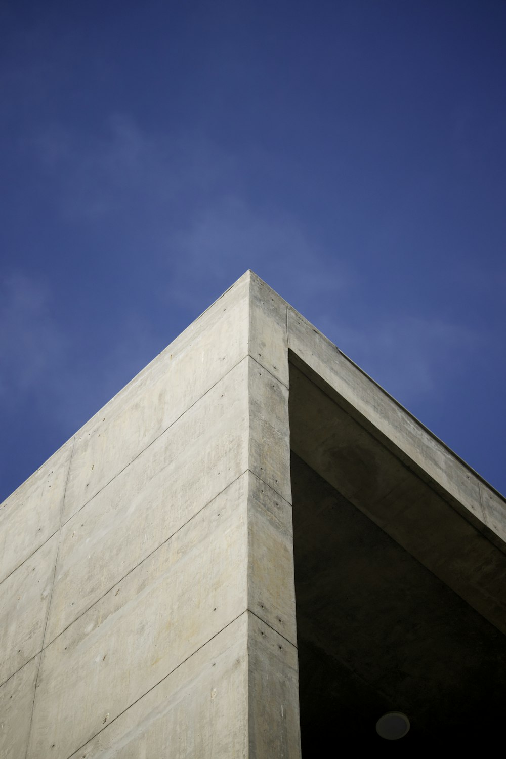 a stone building with a blue sky