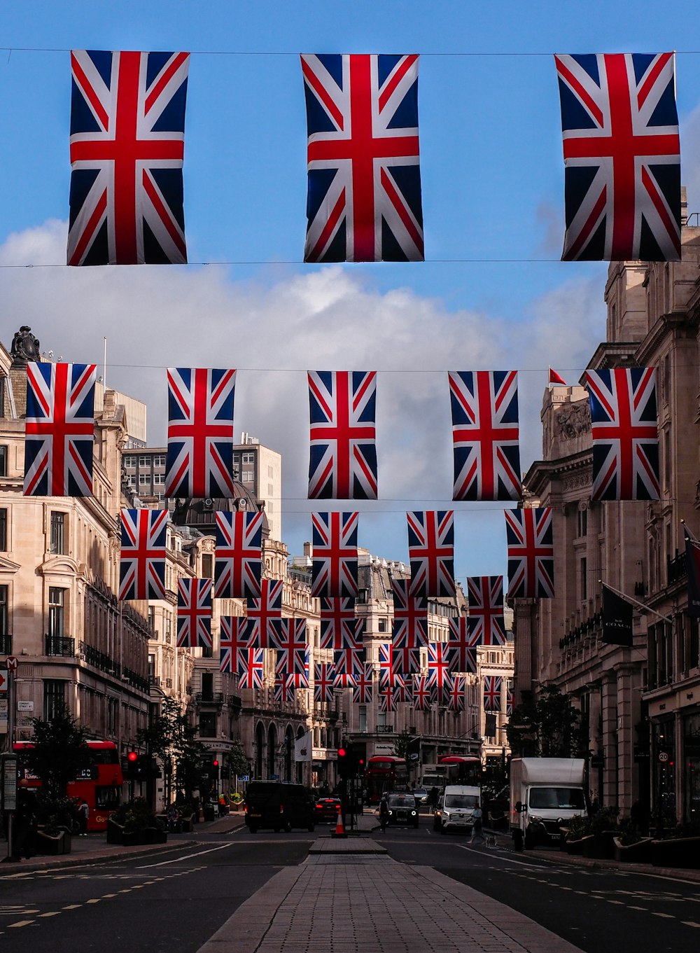 a street with buildings and flags on it