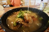 A steaming bowl of Soto Ayam, a fragrant chicken soup.
