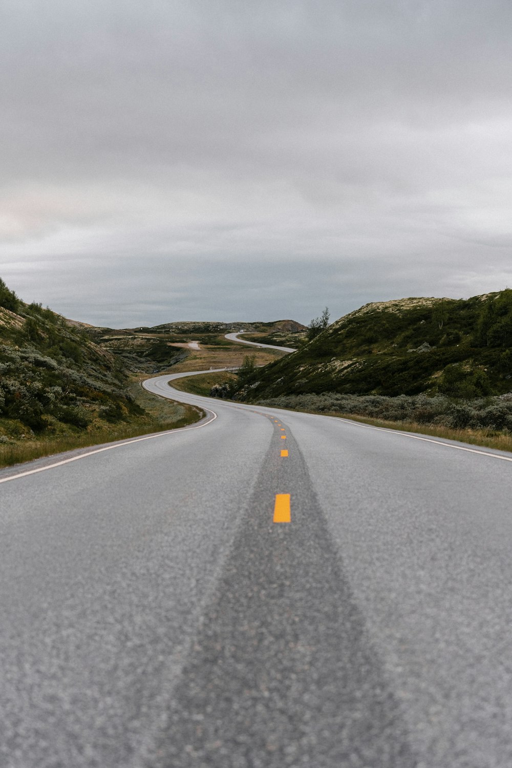 a road with hills on either side