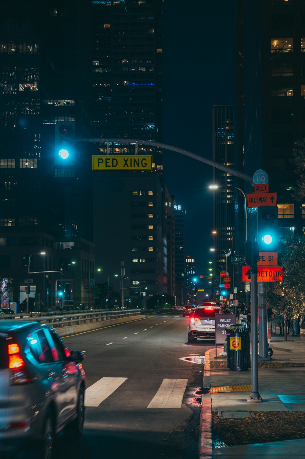 a busy city street at night