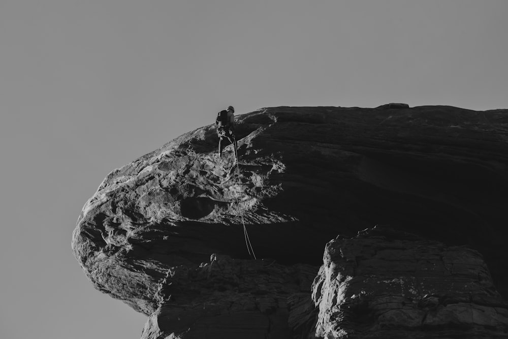 a person climbing a rock