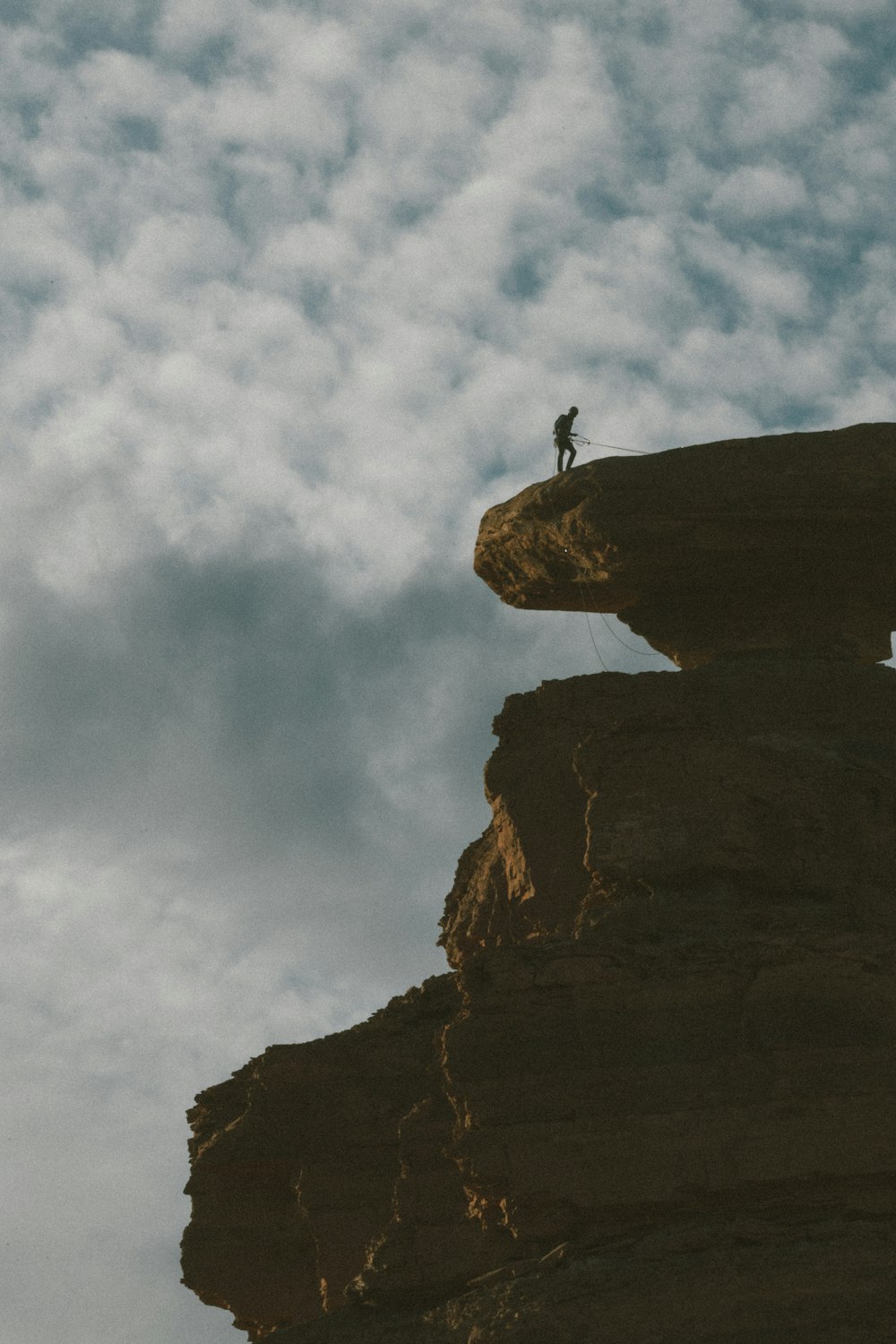 a person standing on a cliff