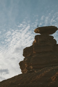 a person standing on a rock