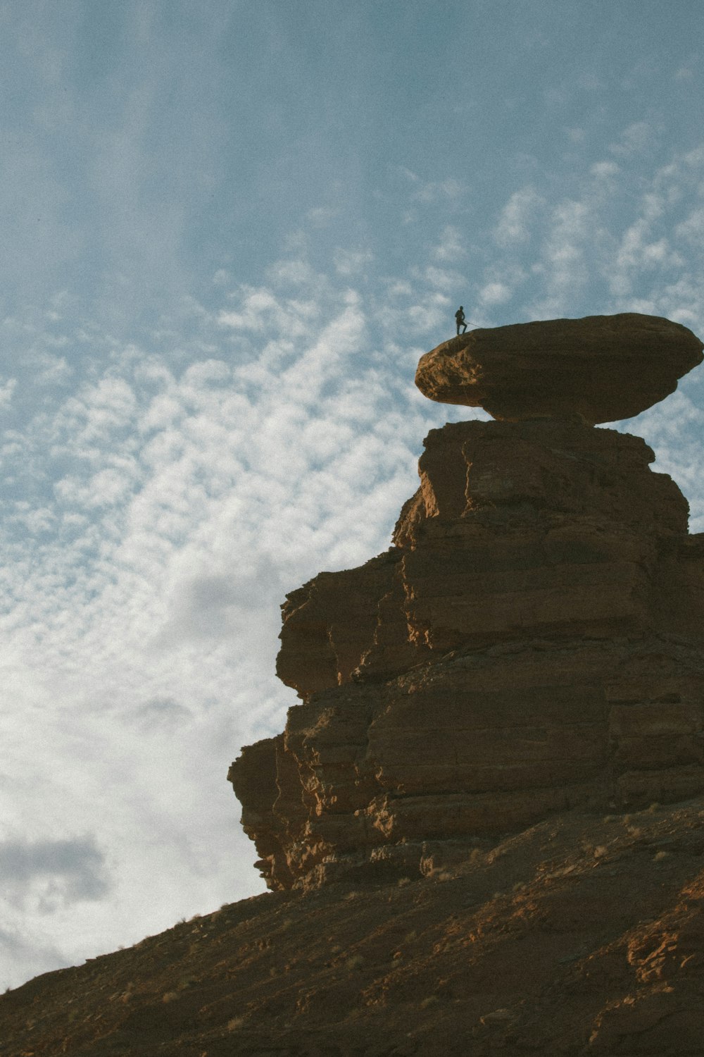 a person standing on a rock