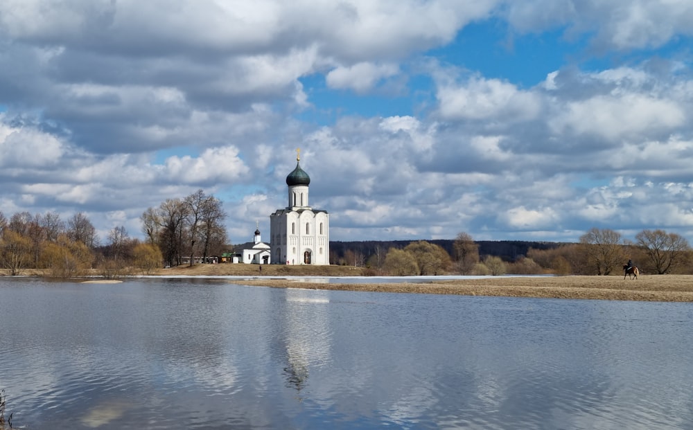 a body of water with a building in the background