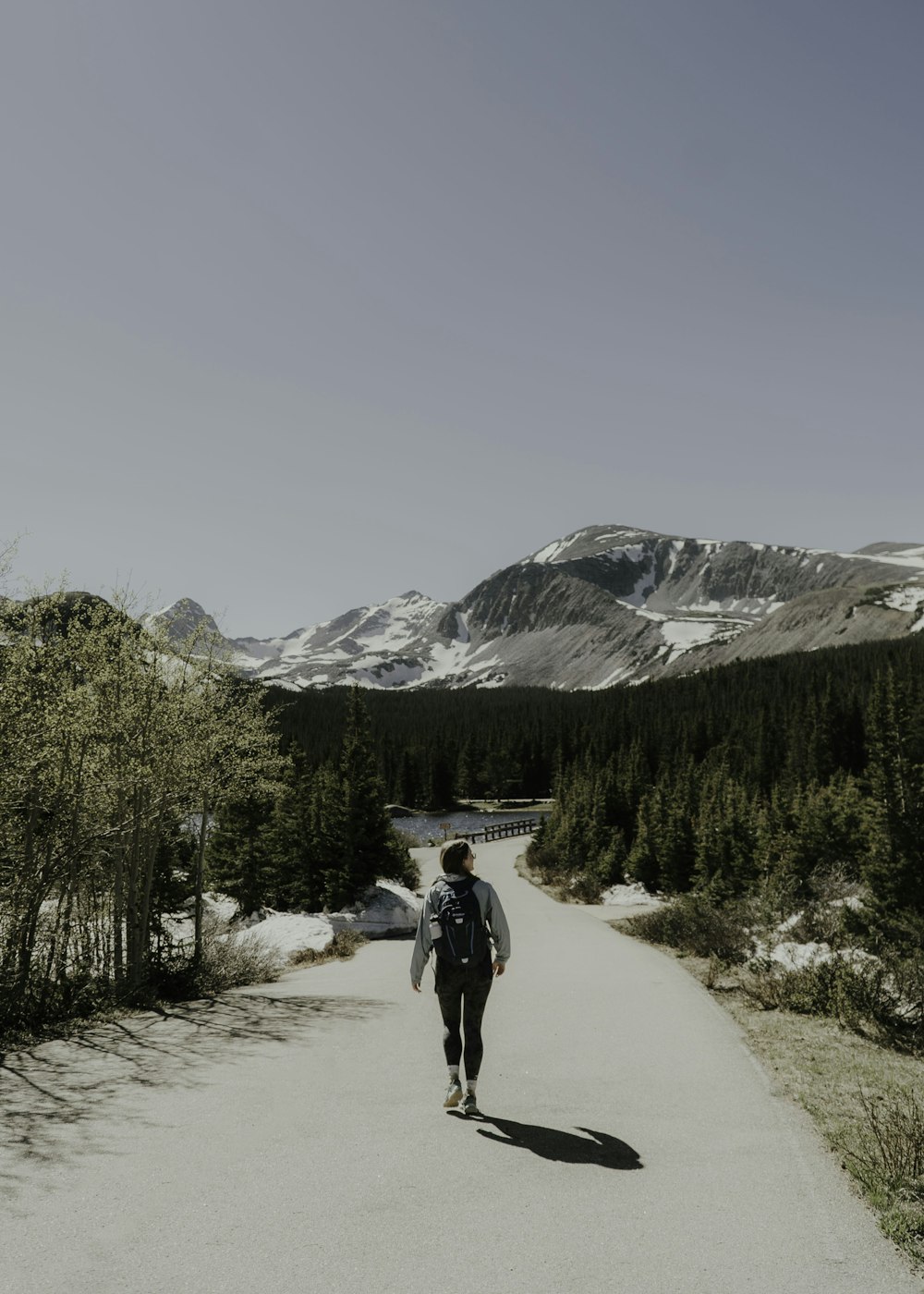 a person walking on a snowy road