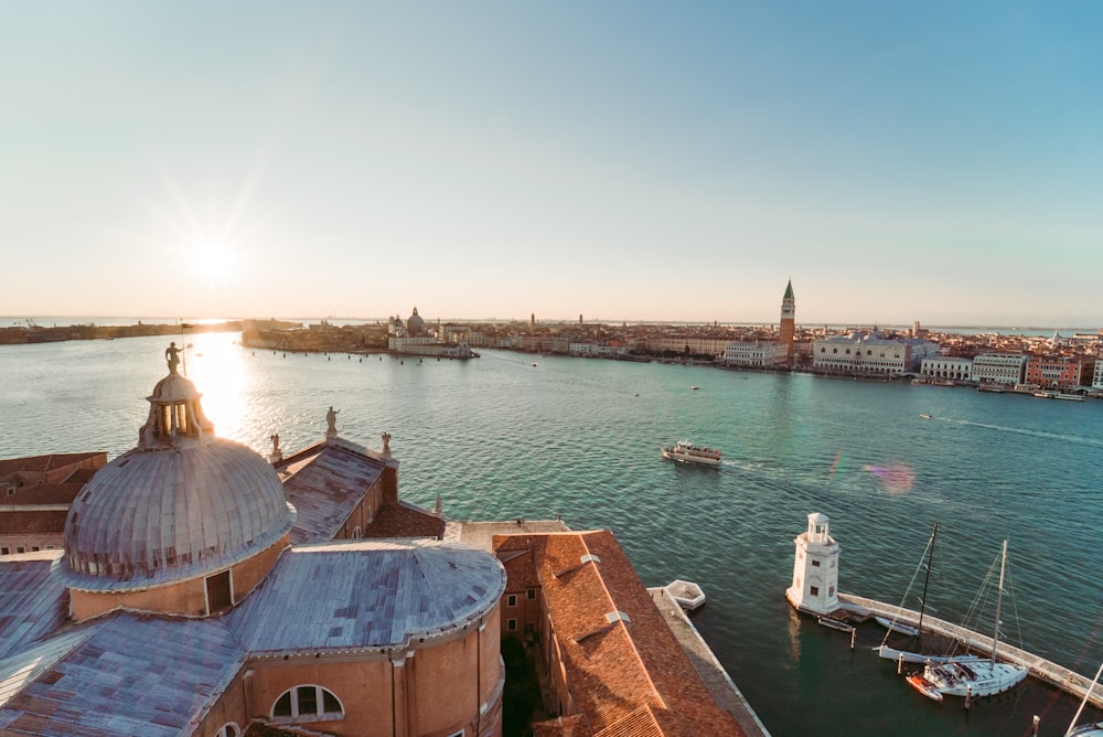 a body of water with boats and buildings along it