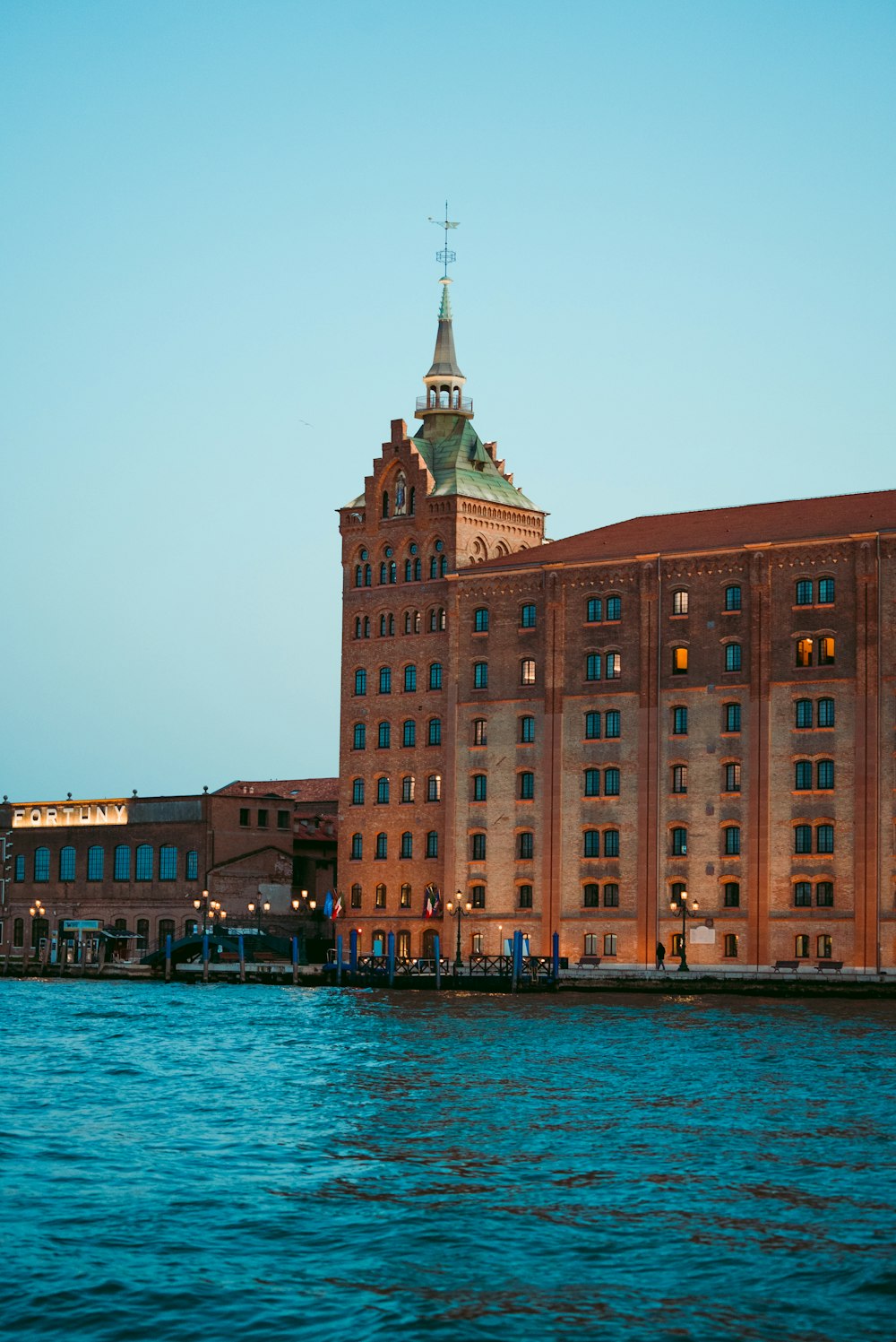 a building next to a body of water