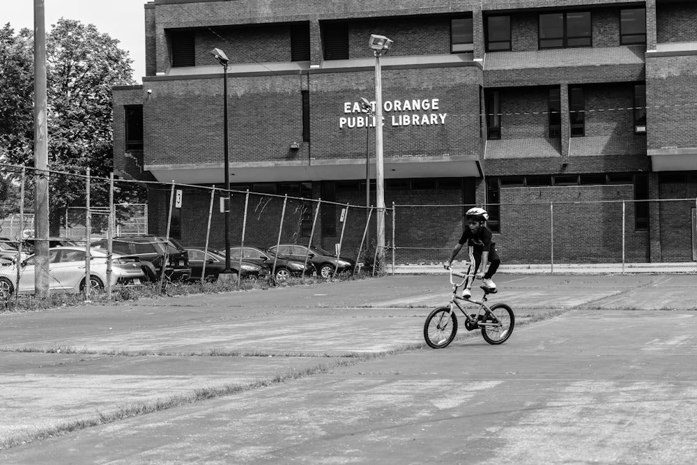 a person riding a bicycle on a street