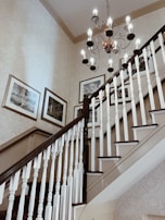 Interior shot of a custom-built staircase with smooth handrails and elegant balusters.