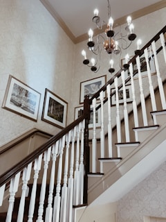 Interior shot of a custom-built staircase with smooth handrails and elegant balusters.