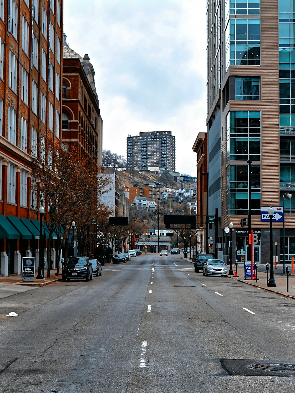 a street with cars and buildings on either side of it