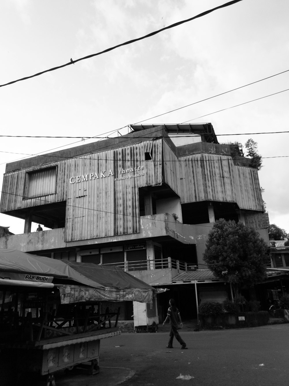 a person walking in front of a building