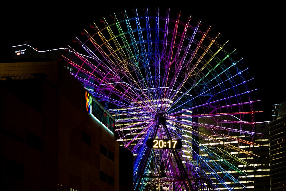 a ferris wheel lit up at night
