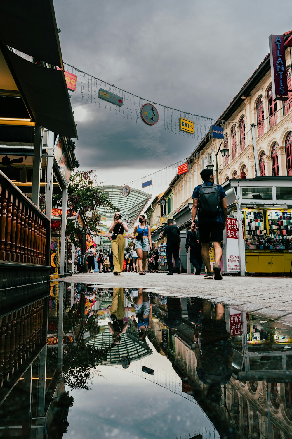 people walking on a wet street