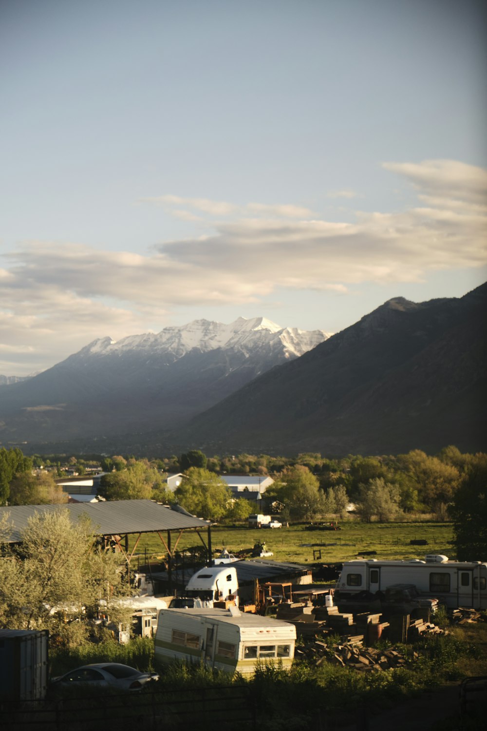 a group of buildings with mountains in the background