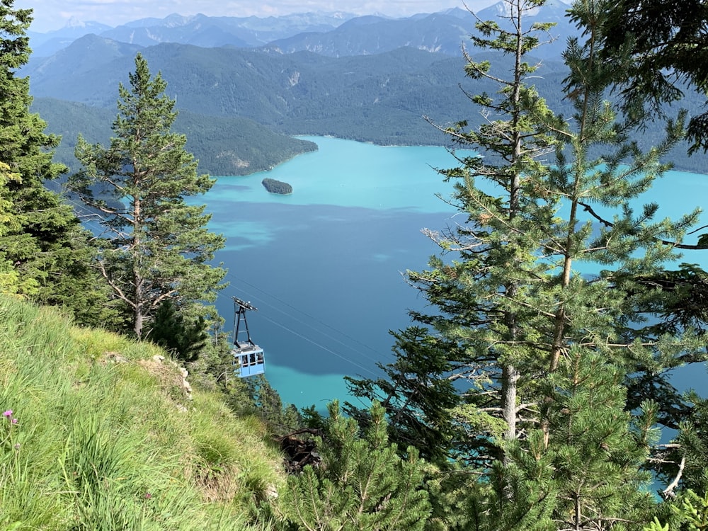 a cable car going over a lake