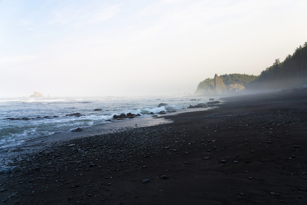 a beach with waves crashing on it