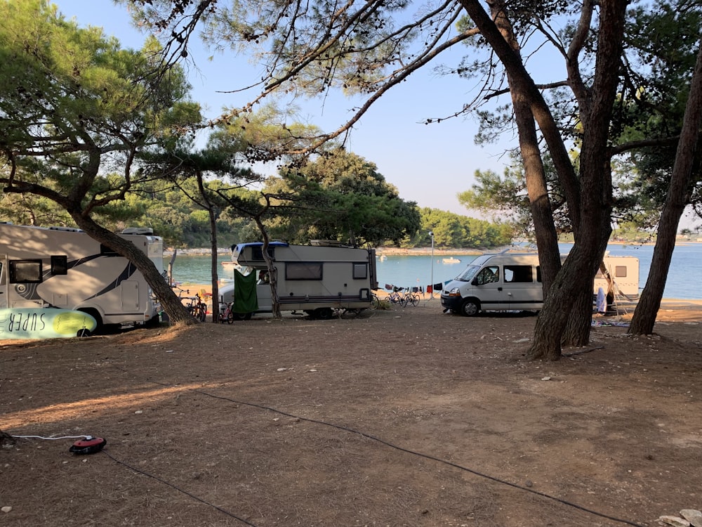 a group of tents next to a body of water