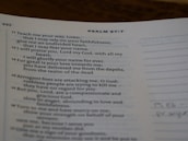 A page from a religious text showing Psalm 87:7, printed in clear black text on white paper. The verses discuss faithfulness and reliance on divine strength. The page is slightly curved, and there is marginal writing.
