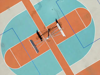 An overhead view of a basketball half-court showing strategic zones.