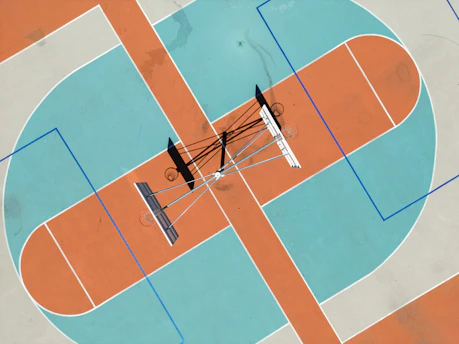 An overhead view of a basketball half-court showing strategic zones.