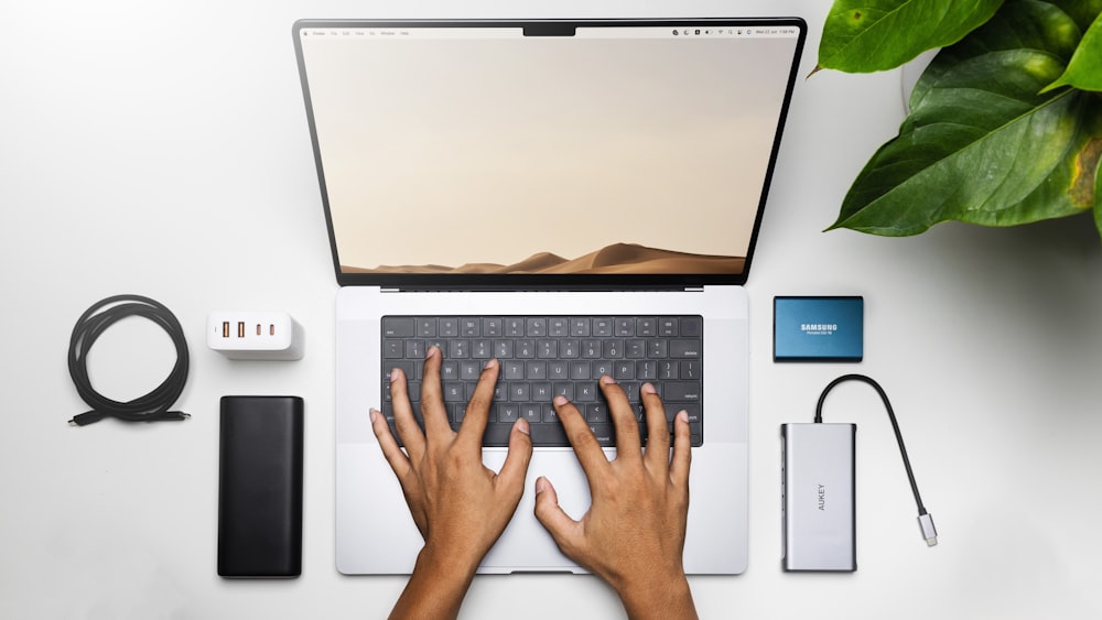 hands on a laptop