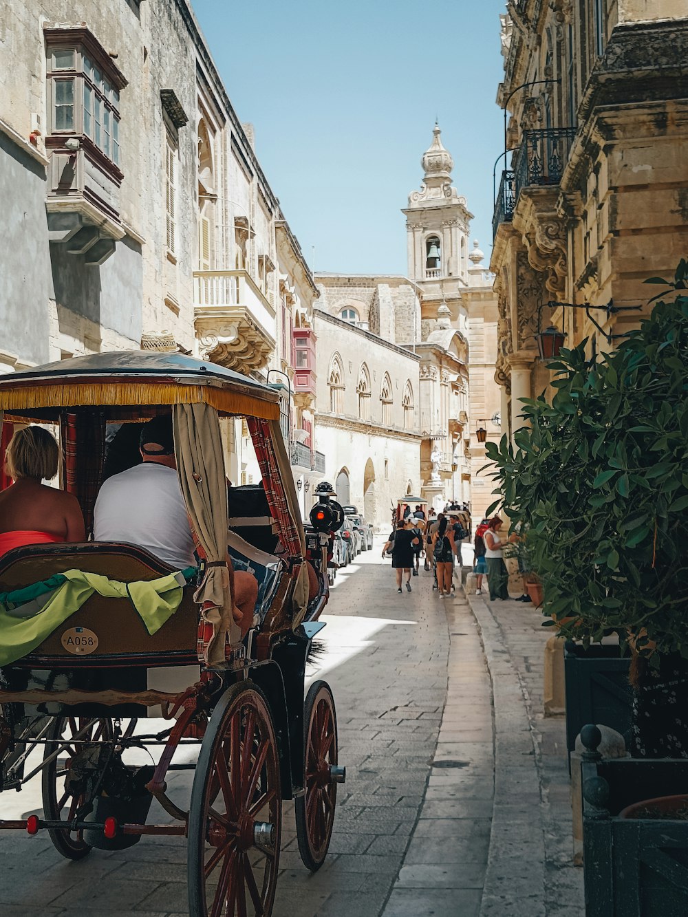 a horse carriage on a narrow street