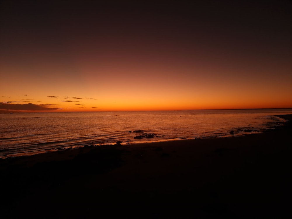 a beach at sunset