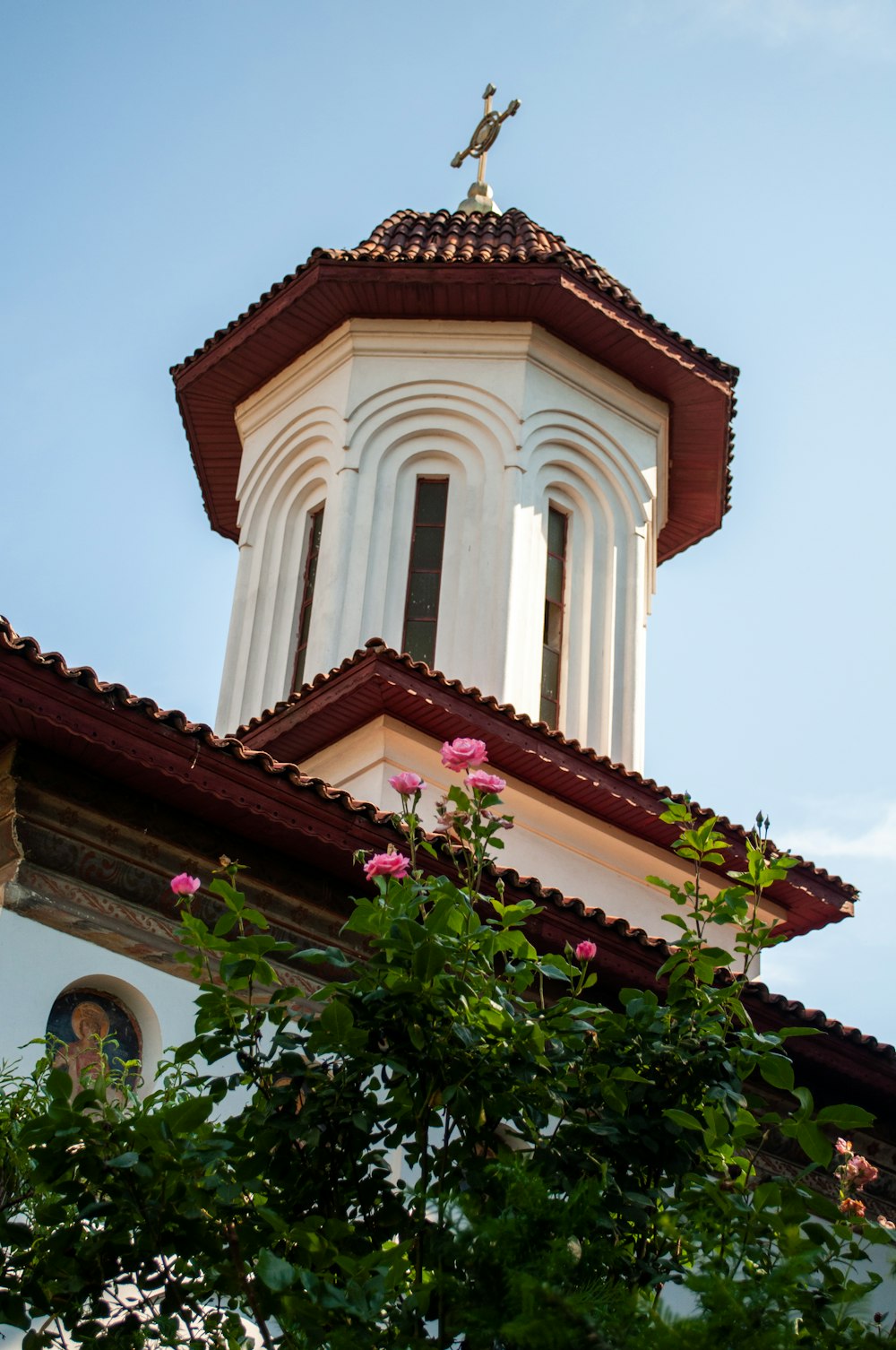 a building with a statue on top