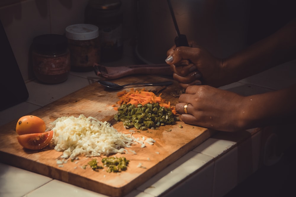 a person cutting vegetables