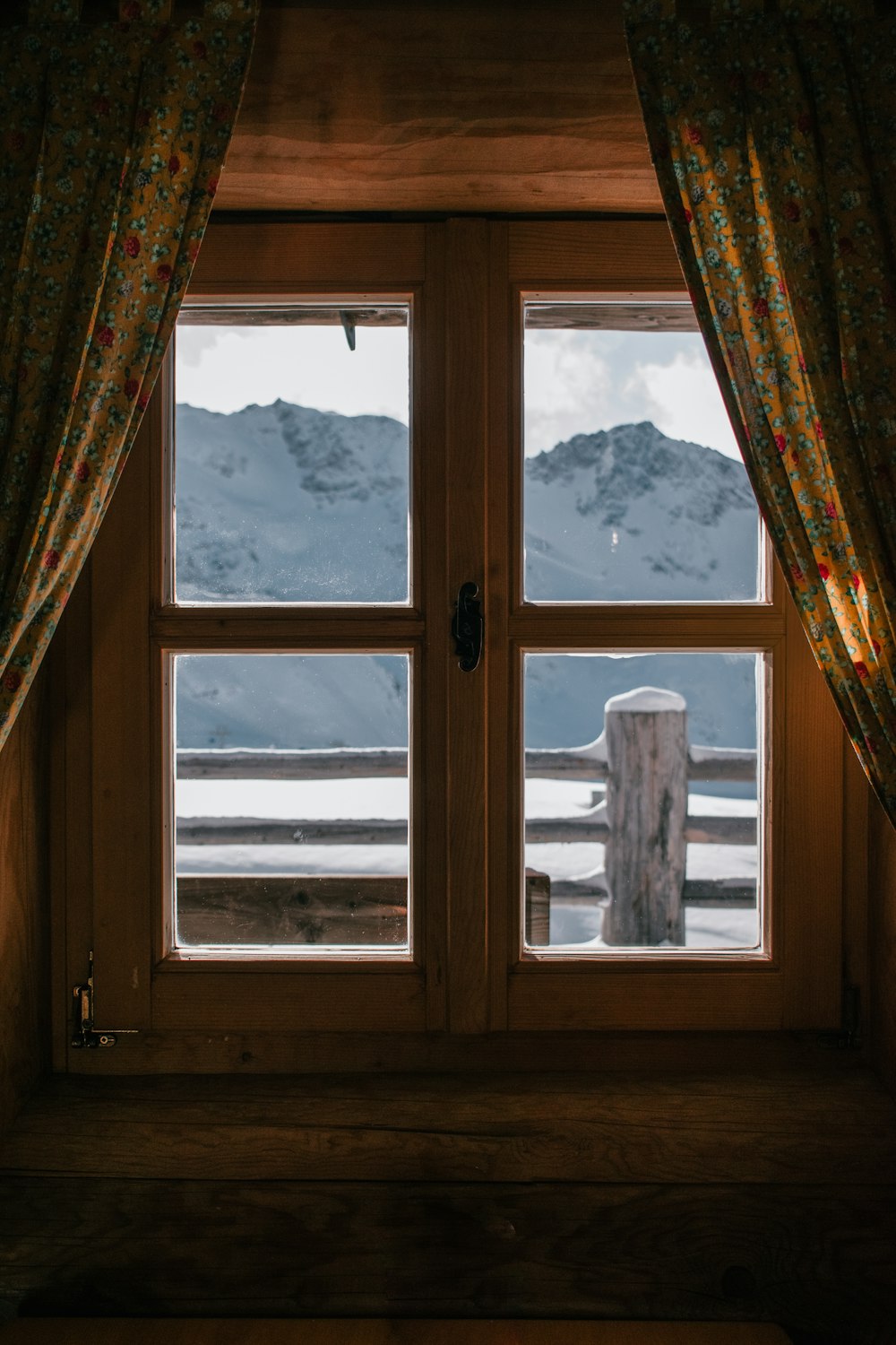 a window with a view of mountains
